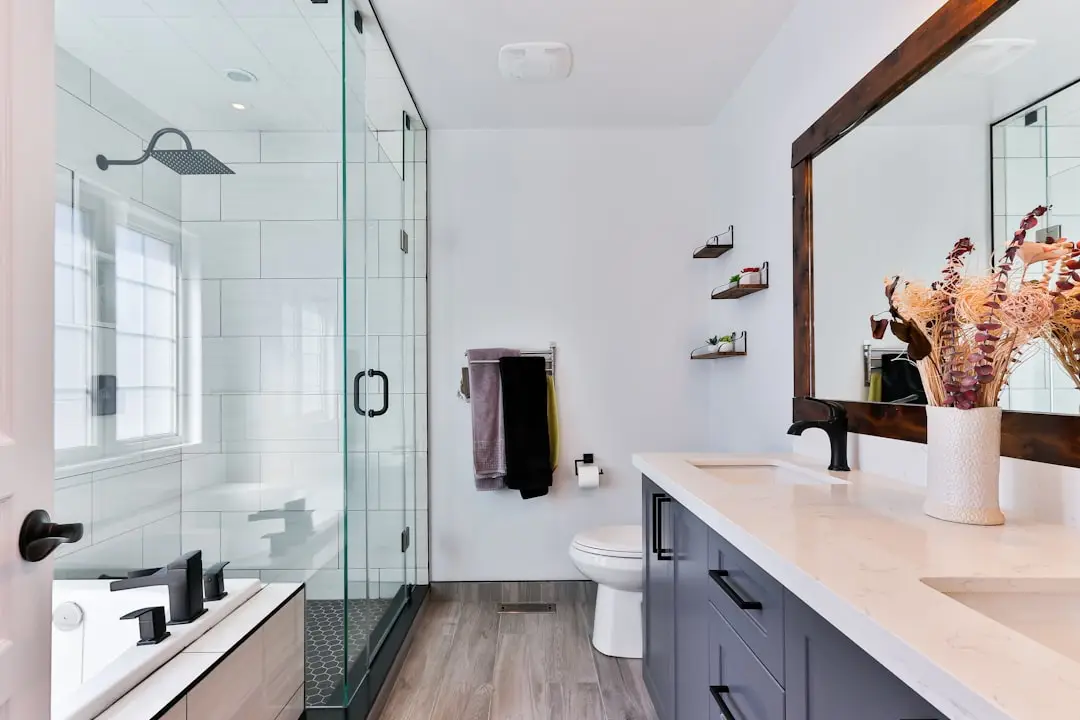 Modern bathroom renovation with tile and custom vanity