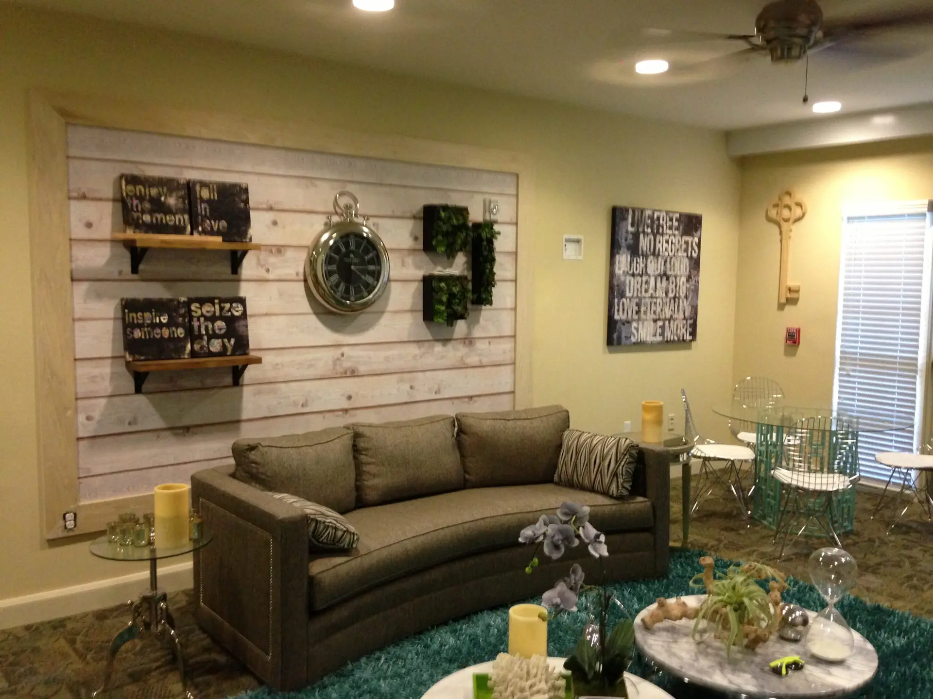 Retail merchandise display wall with mounted shelving in a finished boutique interior