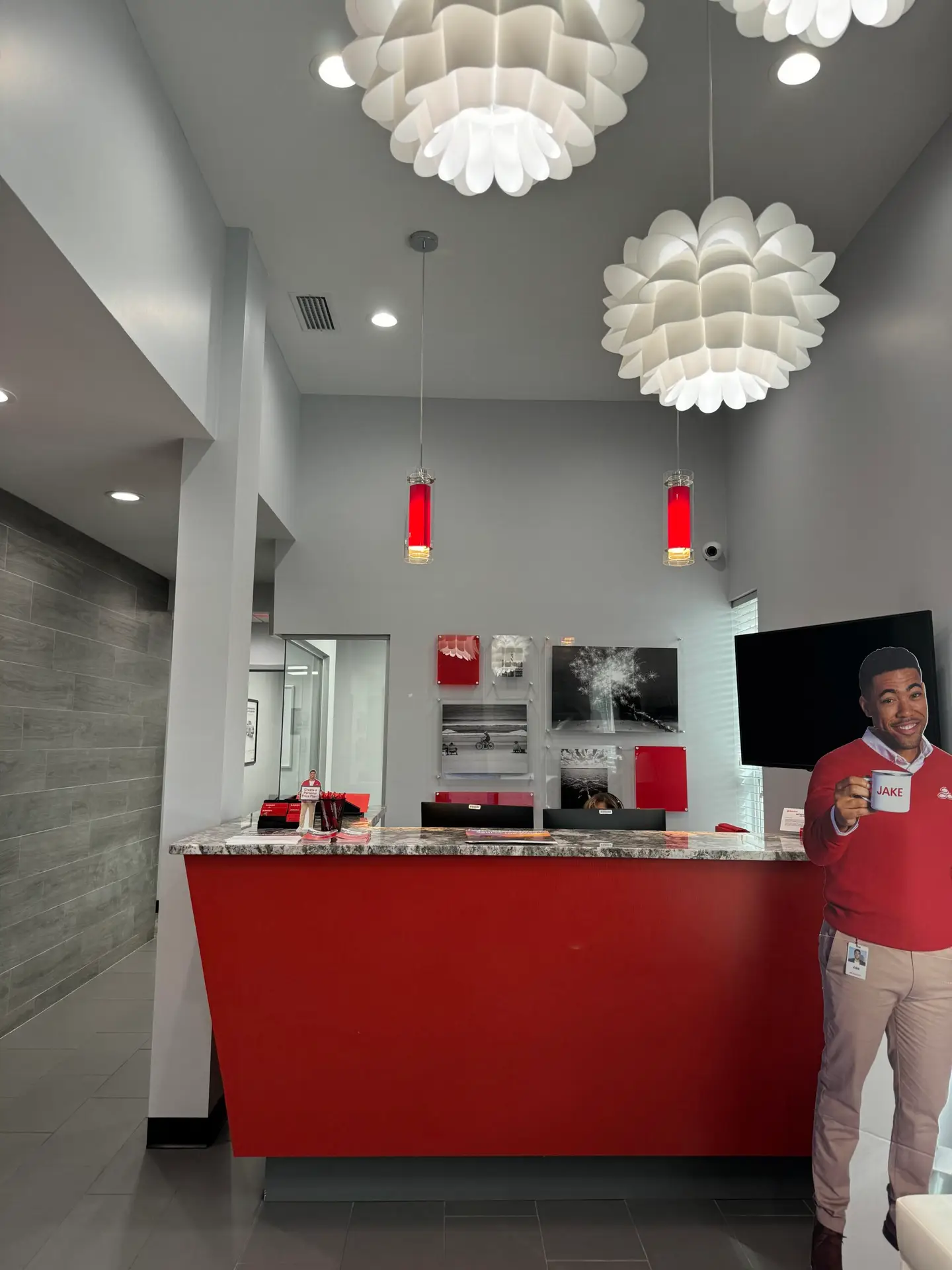 Curved reception and transaction counter in a finished commercial lobby